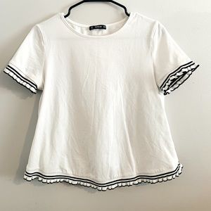 White swing t-shirt with black frill trim